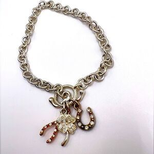 *3/$20* Silver tone toggle bracelet with horseshoe clover and wishbone charms